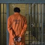 12736460-Handcuffed-prisoner-in-jail-Stock-Photo-prison-jail-man