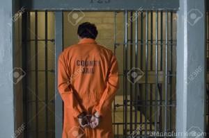 12736460-Handcuffed-prisoner-in-jail-Stock-Photo-prison-jail-man